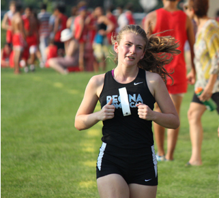 Ellie Spina running in a Cross Country meet