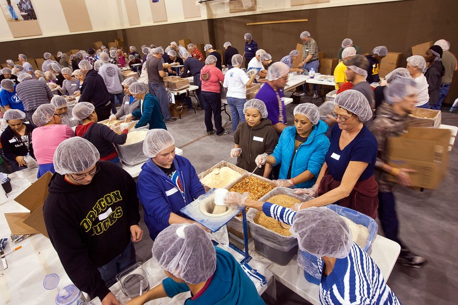 A shift of 400 volunteers prepare life-saving meals that will feed millions of starving children in the developing world. (Truth Photo By Mark Shephard)