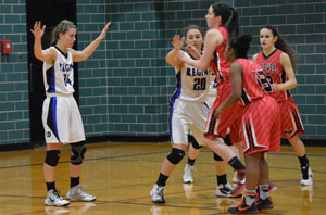 Returning players and current seniors Palmer and Trejo play defense against Niles West.