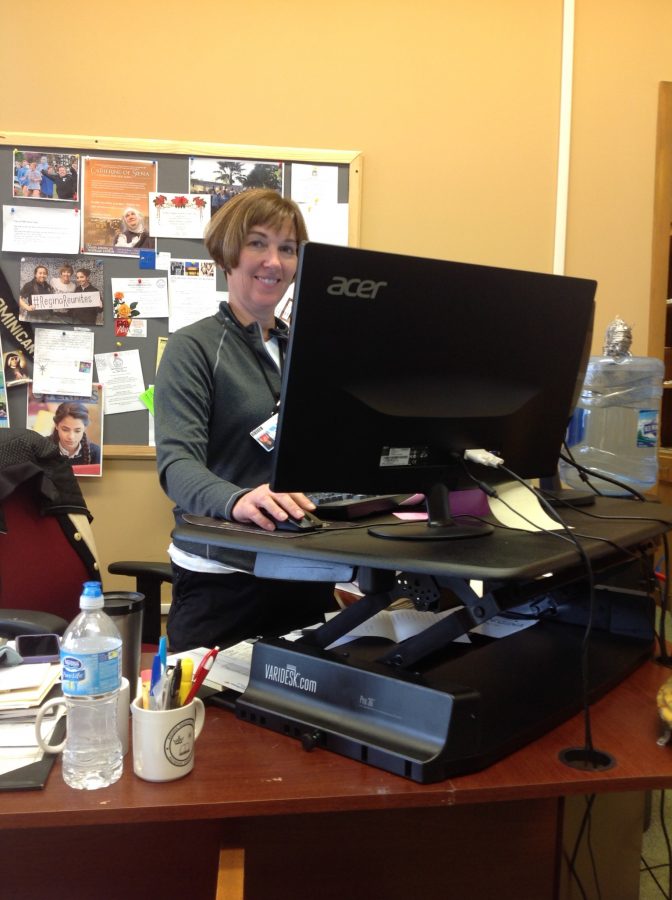 Alumnae Relations Director Diane Garvey using her stand-up desk.