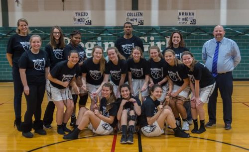 The varsity team and coaches after their senior day game