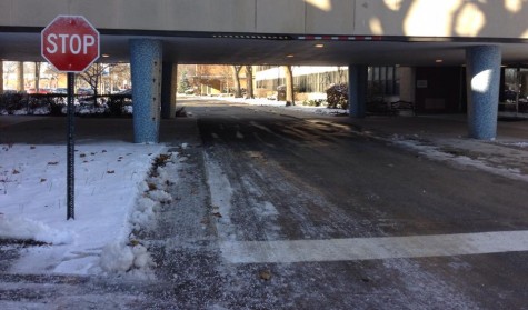 New stop sign before the bridge in Regina Dominican's parking lot
